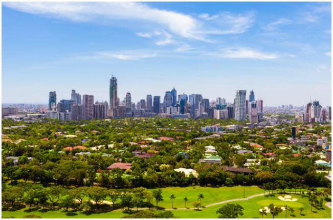 Manila has both green parklands and tall skyscrapers